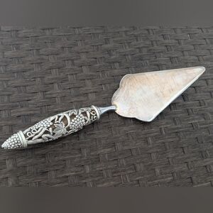 Elegant Silver Cake Server with Intricate Handle